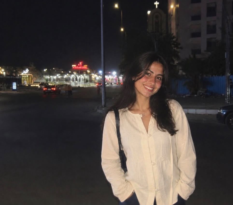 Ivory linen blouse worn outdoors at night