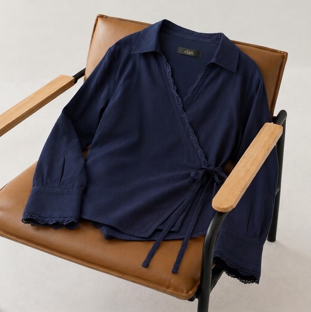 Navy Wrap Linen Blouse on a chair